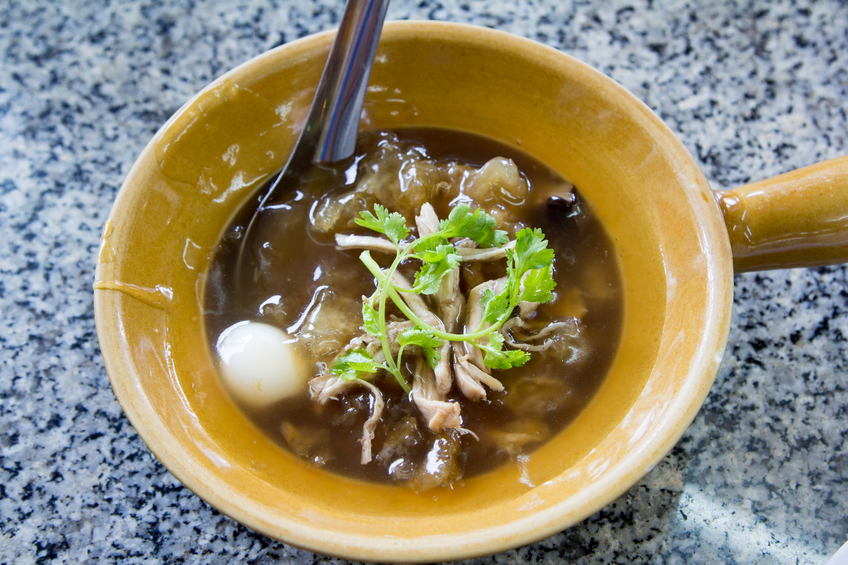Chinese-style Fish maw soup in deep bowl.